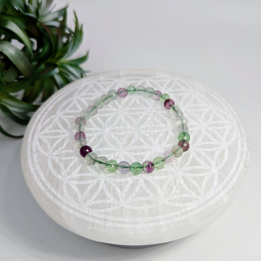 Colorful beaded Fluorite faceted 7-inch bracelet with 6mm beads displayed