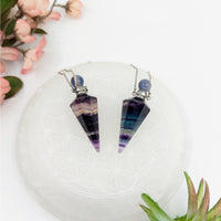 Two fluorite point pendulum necklaces in a protective stones elixir bottle necklace