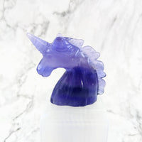 Thumbnail for Purple glass unicorn head carving on white marble background, product: Fluorite Unicorn