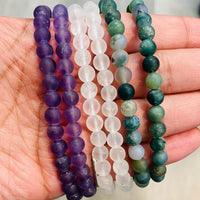 Thumbnail for Frosted Bracelet J586 featuring purple, clear, and green-blue beads on a palm