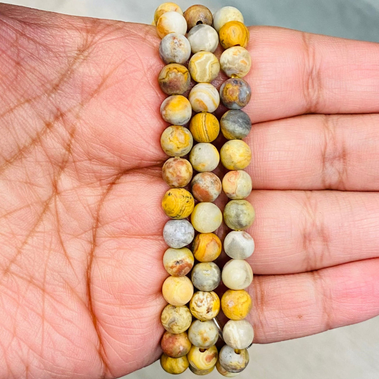 String of round, multicolored Crazy Lace Agate beads in Frosted Bracelet #J586 for item tier benefits