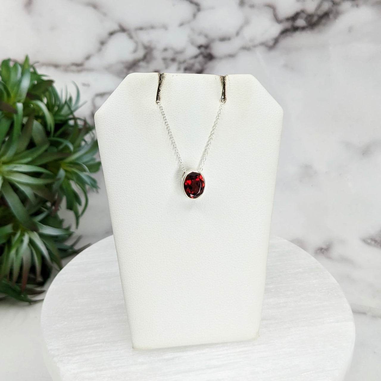 Red garnet necklace on white stand - Garnet Faceted Necklace Sterling Silver Slider #LV3250