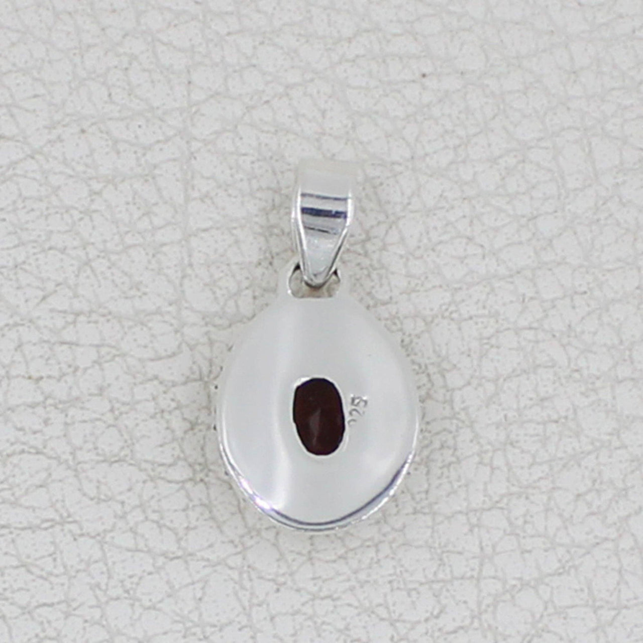 Sterling silver teardrop pendant with faceted oval garnet and circle designs #BC0409