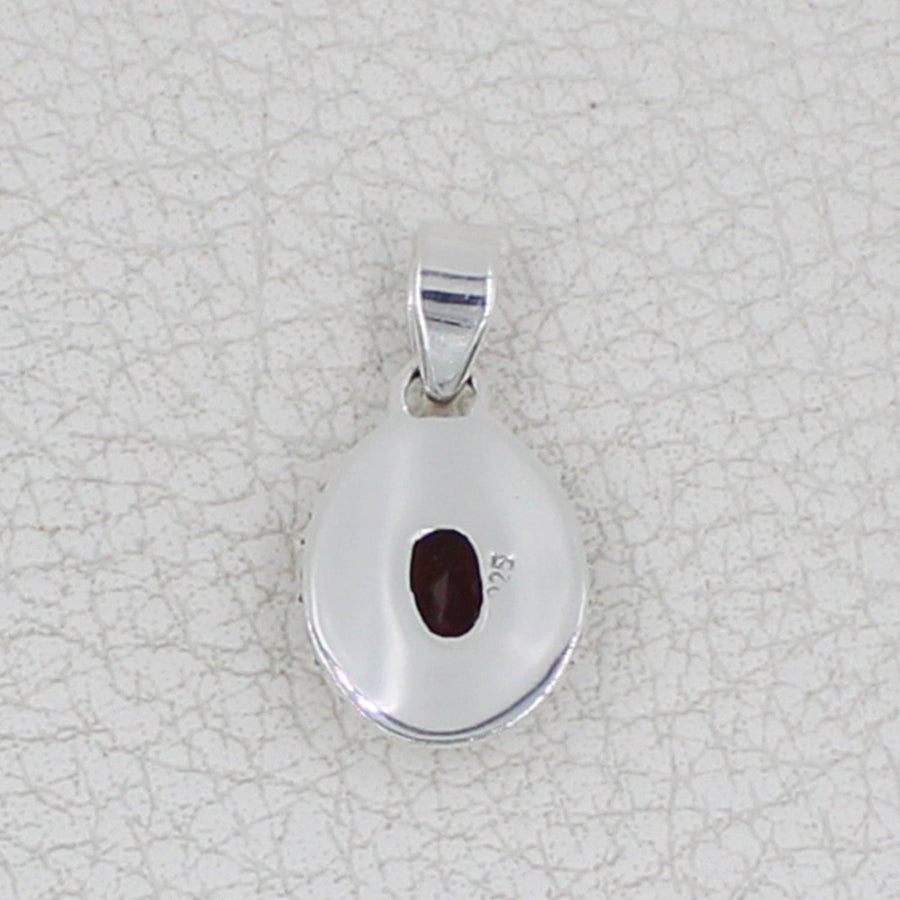 Sterling silver teardrop pendant with faceted oval garnet and circle designs #BC0409