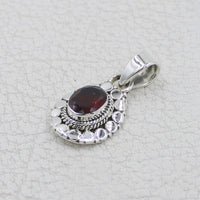 Garnet faceted oval sterling silver pendant with circle designs #BC0409