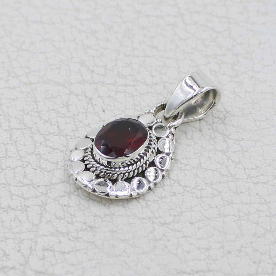 Garnet faceted oval sterling silver pendant with circle designs #BC0409