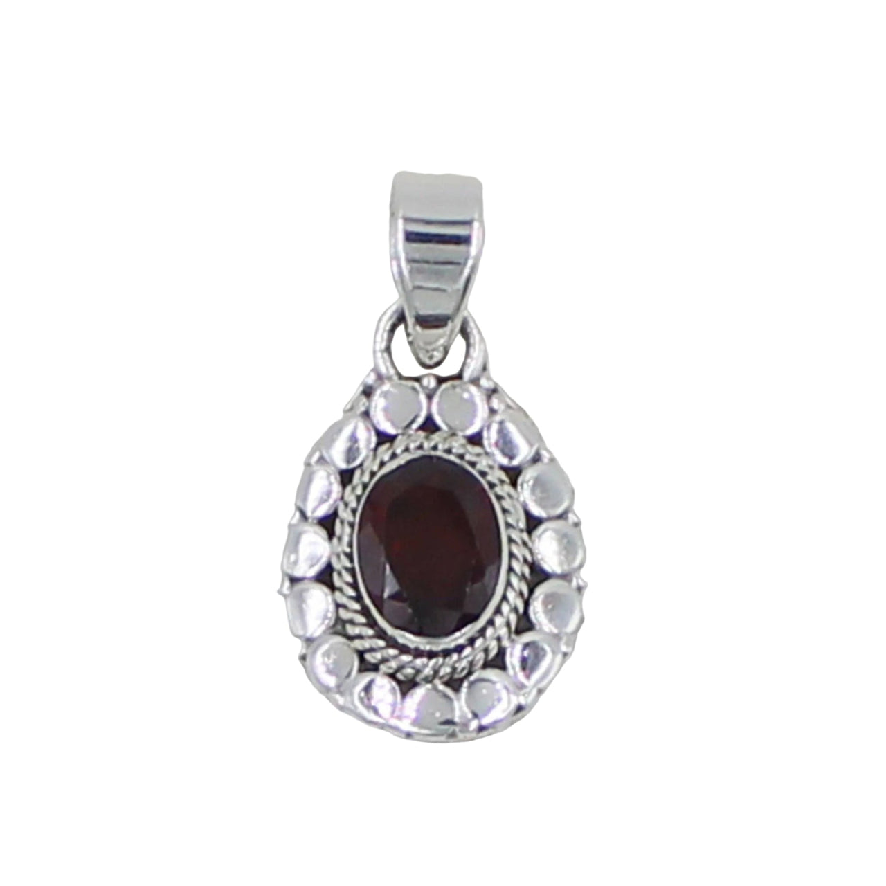Silver pendant with a red gemstone on a light gray background