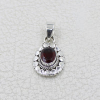 Garnet faceted oval sterling silver pendant with circle designs #BC0409