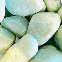 Thumbnail for Smooth, polished garnierite tumbled stones with a jade-green translucent appearance