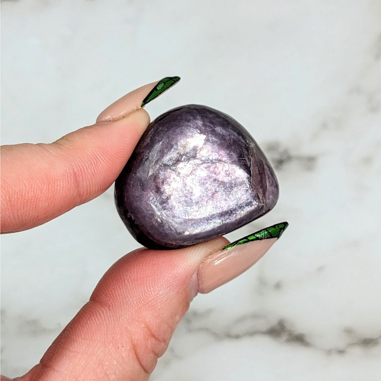 Person holding Lepidolite Gem LV4563, 1.2’ tumbled stone for healing and balance