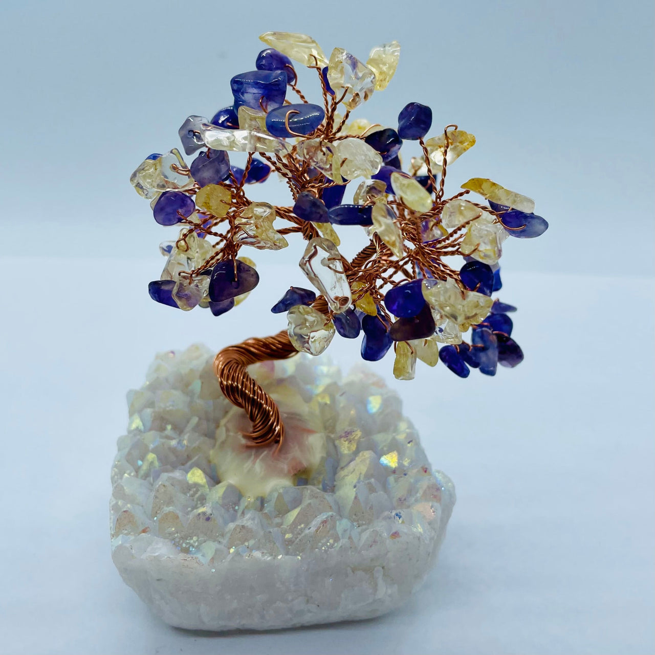 Decorative gem tree sculpture on Angel Aura Base featuring blue and clear crystals