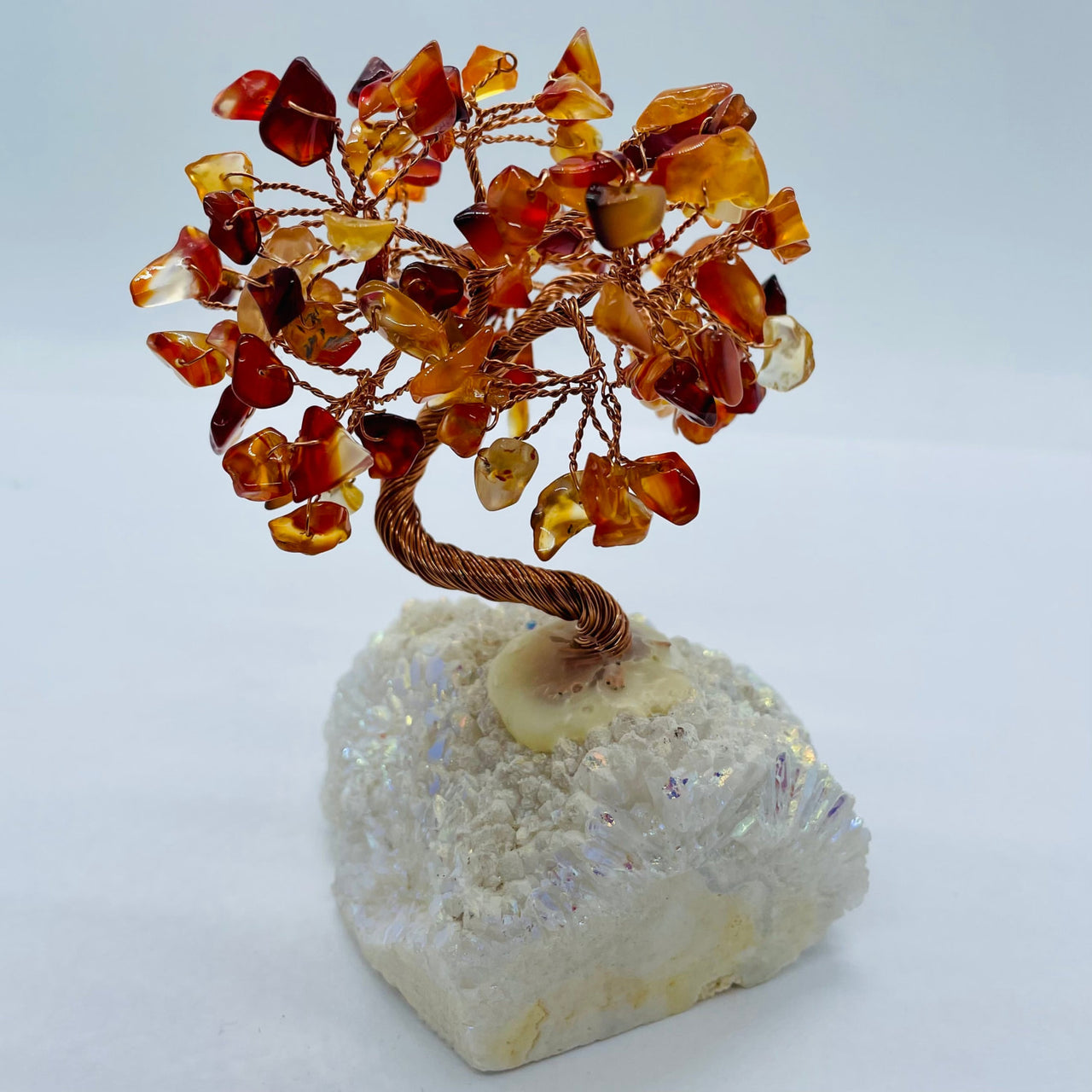 Amber-colored Gem Tree sculpture on an Angel Aura Base enhancing decor and energy