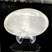 A translucent oval girasol quartz jumbo pebble with smooth polished surface and subtle internal crystalline patterns