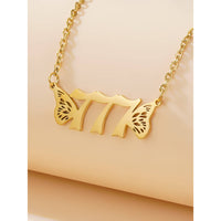Gold-toned necklace with 777 and butterfly wings from Gold Angel Number Necklace #LV7398