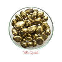 Thumbnail for Gold Chalcopyrite Tumble Stone in a glass bowl showcasing polished gold-colored stones