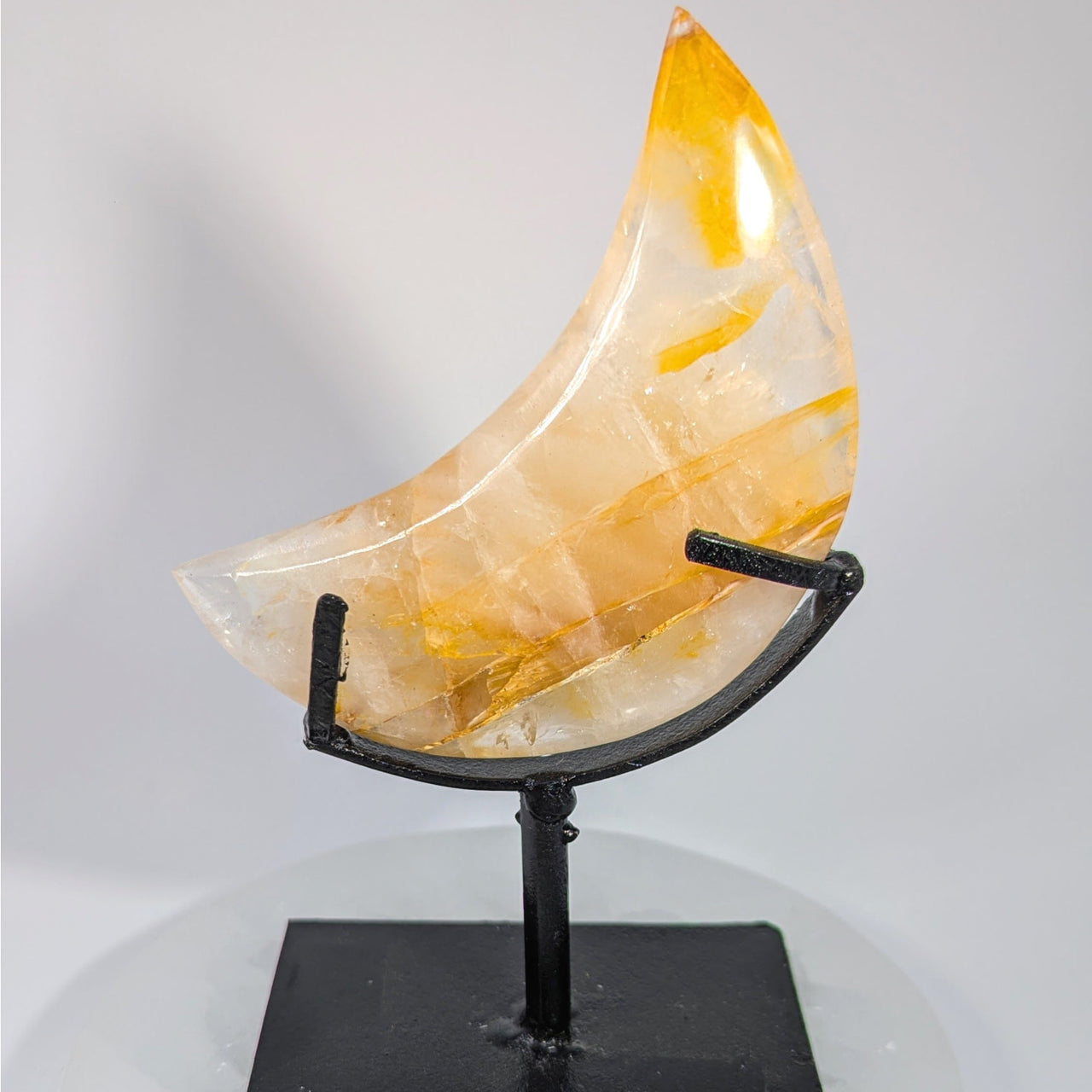 Translucent orange white fluorite geode crescent moon on black stand #BC0770