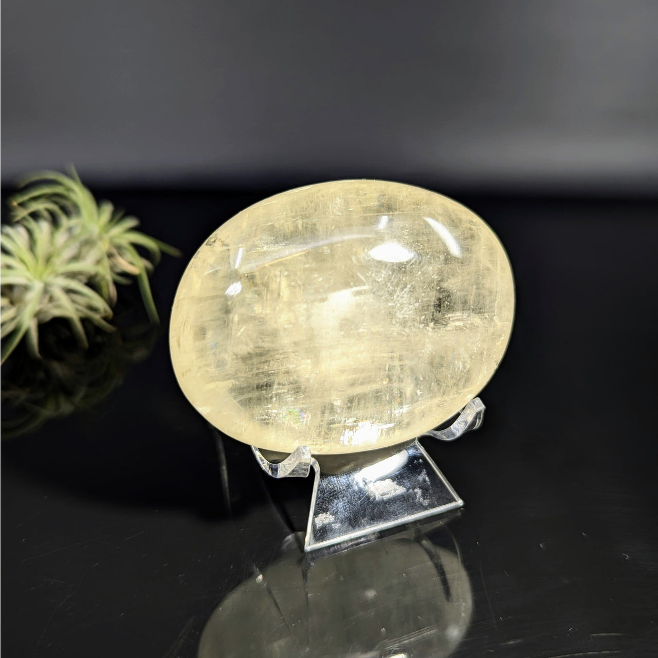 Translucent yellow calcite crystal on stand for Gold Optical Calcite 2.5 inch Palm Stone