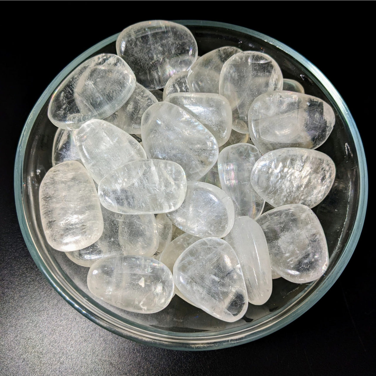 Ice cubes in a bowl showcasing the Gold Optical Calcite Palm Stone #LV2264 product