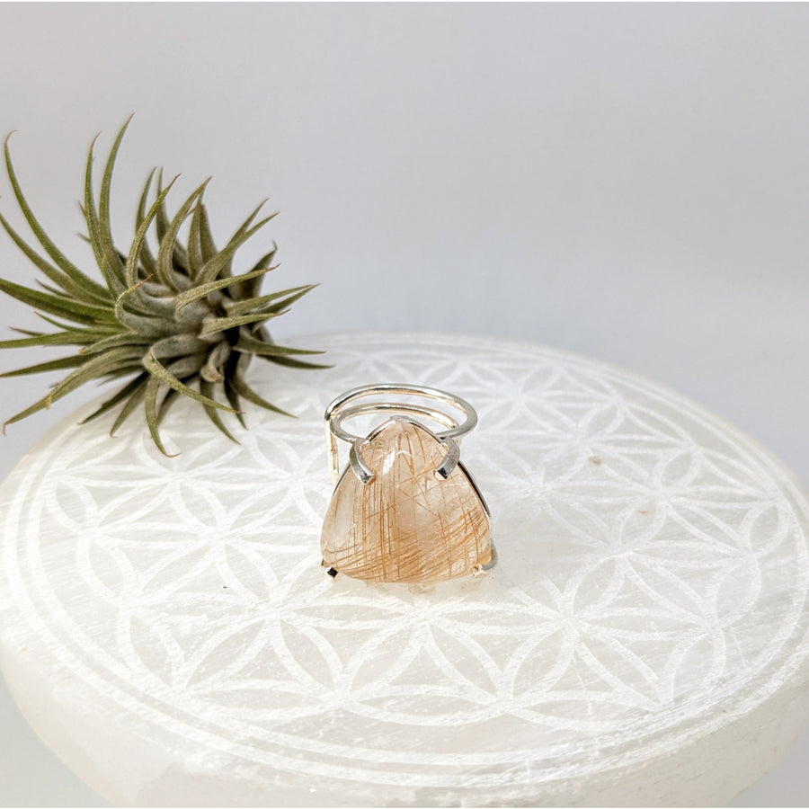 Triangular Gold Rutilated Quartz ring showcasing bliss crystals for spiritual growth