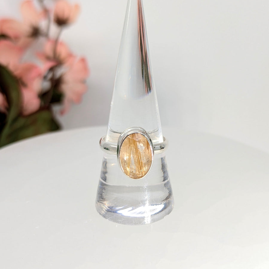 Silver ring with gold rutilated quartz gemstone for spiritual growth and elegance