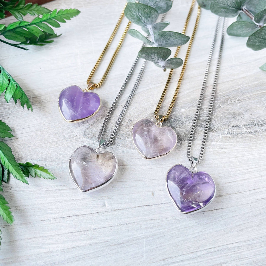 Four silver amethyst heart pendants on delicate chains, LV9397