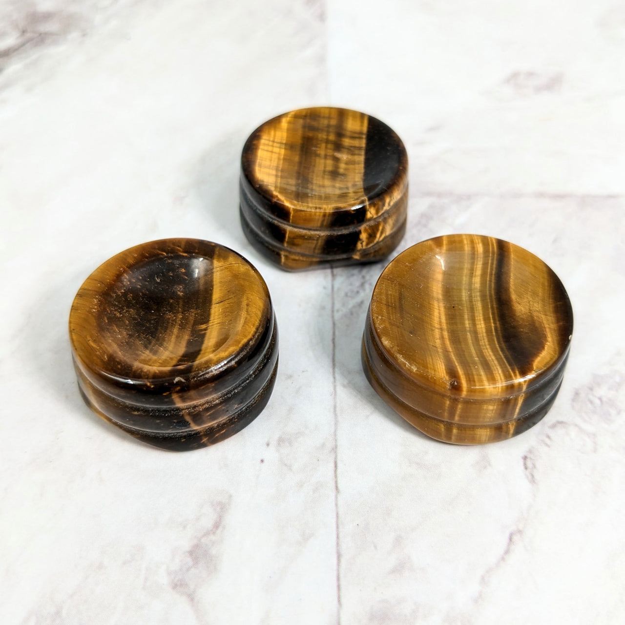 Gold Tiger’s Eye 1’ Sphere Holder LV2330: Three Wooden Grinds on Marble Surface
