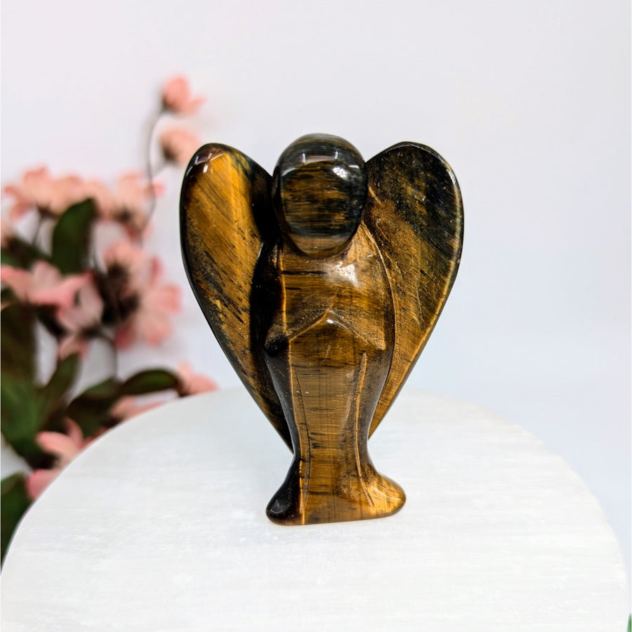 Gold tiger’s eye large angel carving showcasing tiger’s eye holds spiritual charms