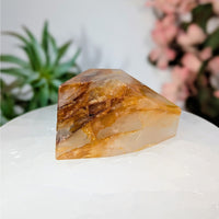 Translucent quartz crystal with golden inclusions in Golden Healer 2.6-inch Quartz Geo Freeform