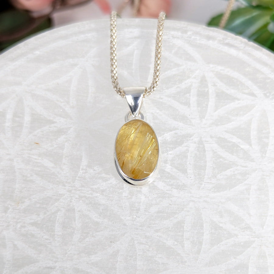 Golden Rutilated Quartz pendant necklace with oval faceted silver setting