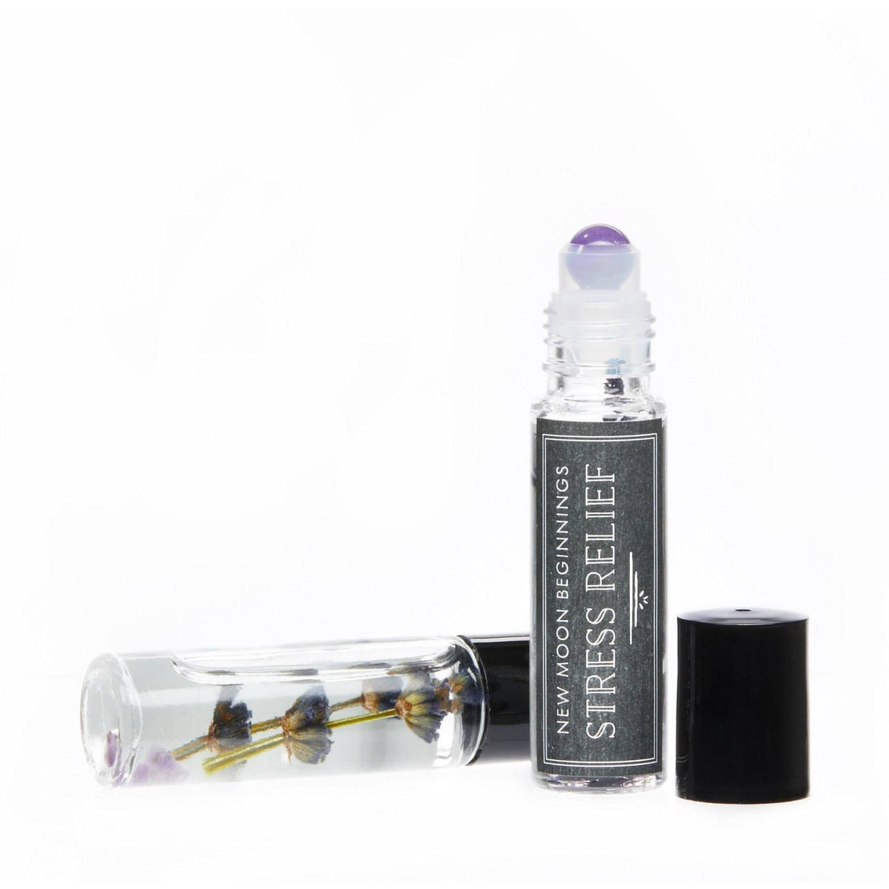 A bottle of Good Luck: Intention Roll on perfume with jojoba oil base and crystal infusion