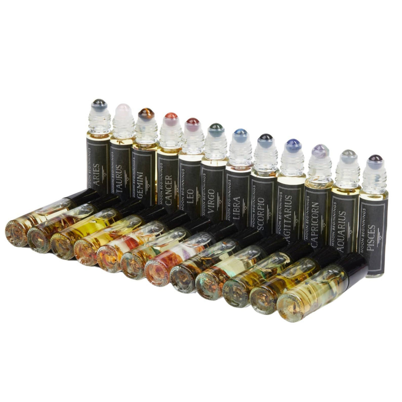 A group of bottles filled with colorful liquids in Good Luck: Intention Roll on Perfume 10ml