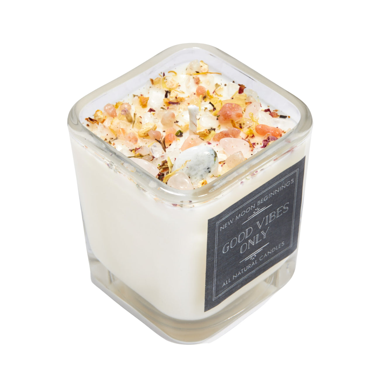 Good Vibes Only ritual soy candle with pink crystals, dried flowers, and herbs in glass vessel