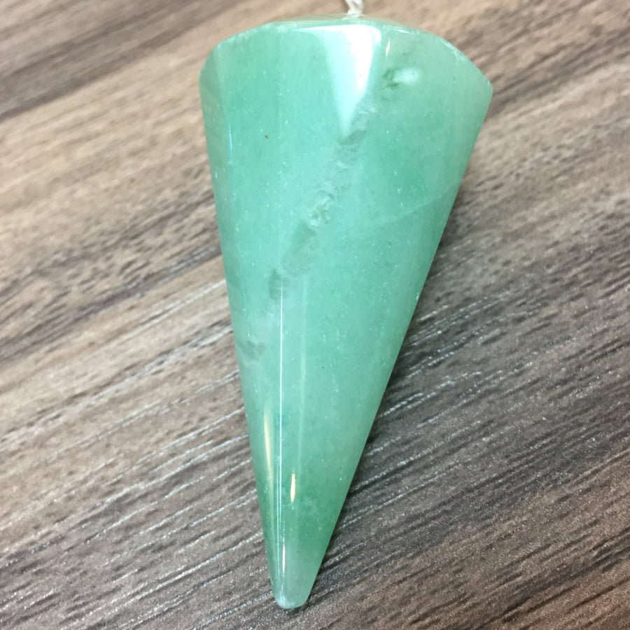 Green crystal pendulum made from Green Aventurine for healing and divination purposes