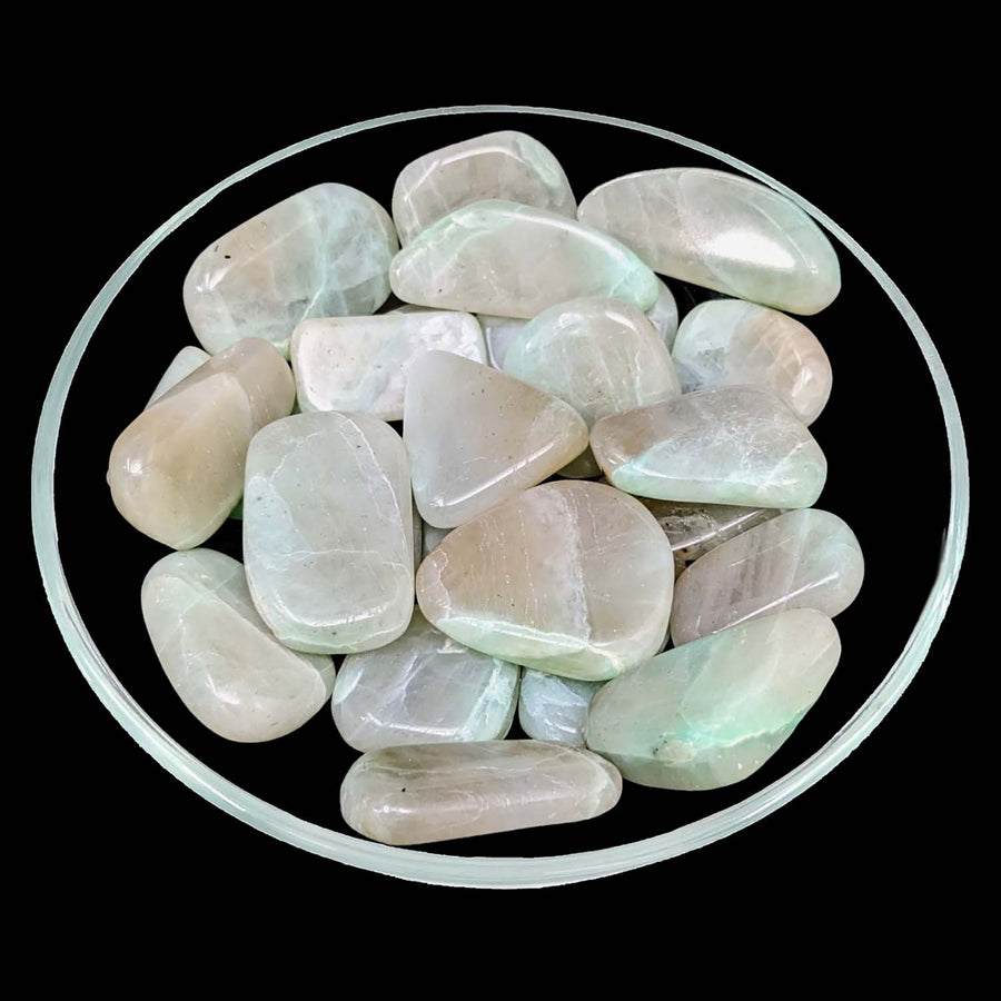 Bowl of green and white stones featuring 1 Green Moonstone A Palm Stone #LV1266 with item tier benefits