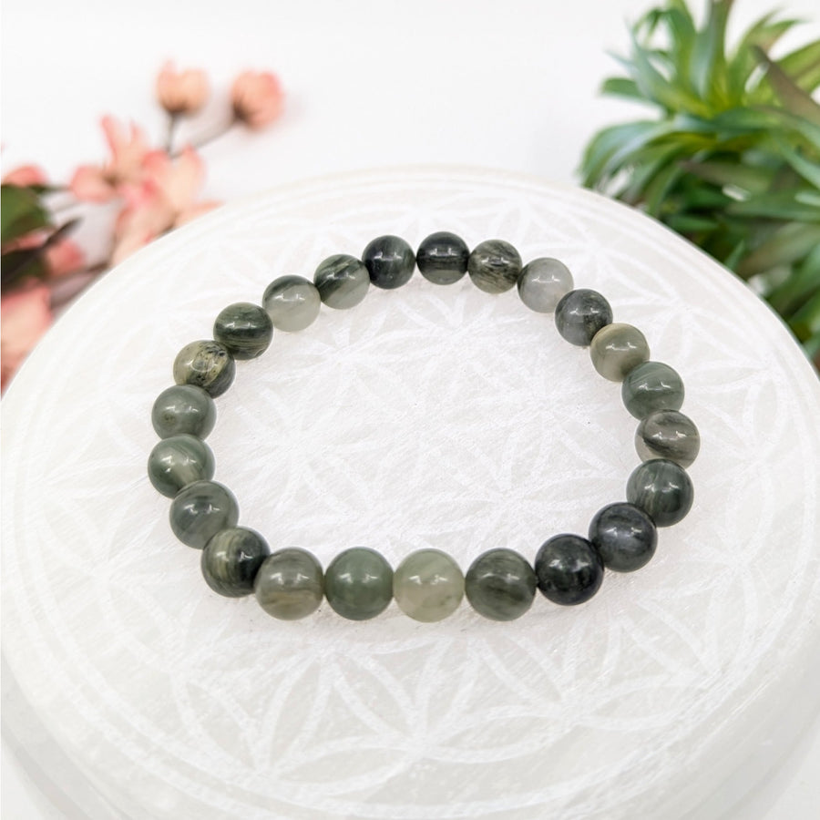 Green and gray beaded bracelet on display in the Green Sardonyx 7 inch Bracelet LV8455