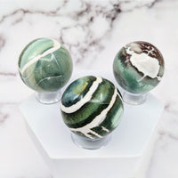 Thumbnail for Green Sardonyx Sphere #S065: Three marble spheres on a marble pedestal