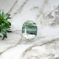 Thumbnail for Green Zebra 22.1’ Sardonyx Palm stone block on a marble counter #LV5166