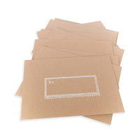 Thumbnail for Stack of kraft paper envelopes with decorative address labels for Eye Wish Birthday card