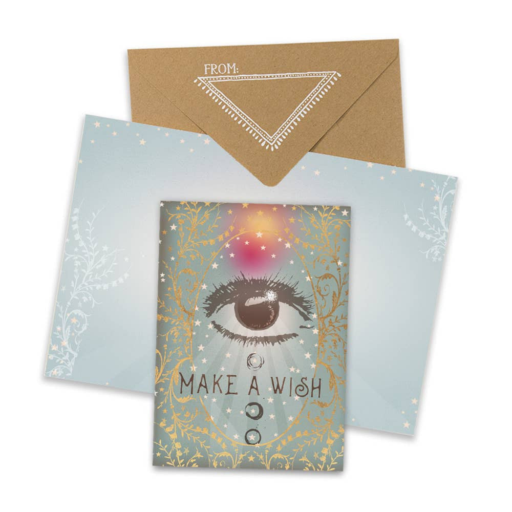 Greeting card with mystical eye design and Make a Wish text and golden accents