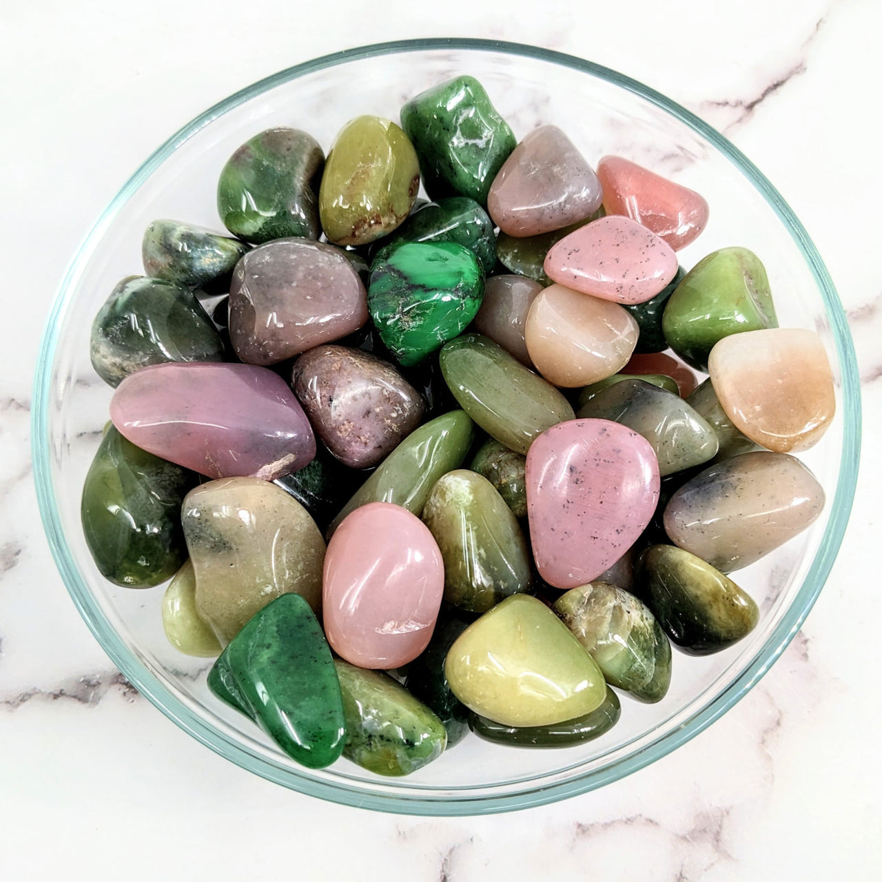 Tumbled stones: Grossularite Garnet in green and pink in a colorful rock bowl display