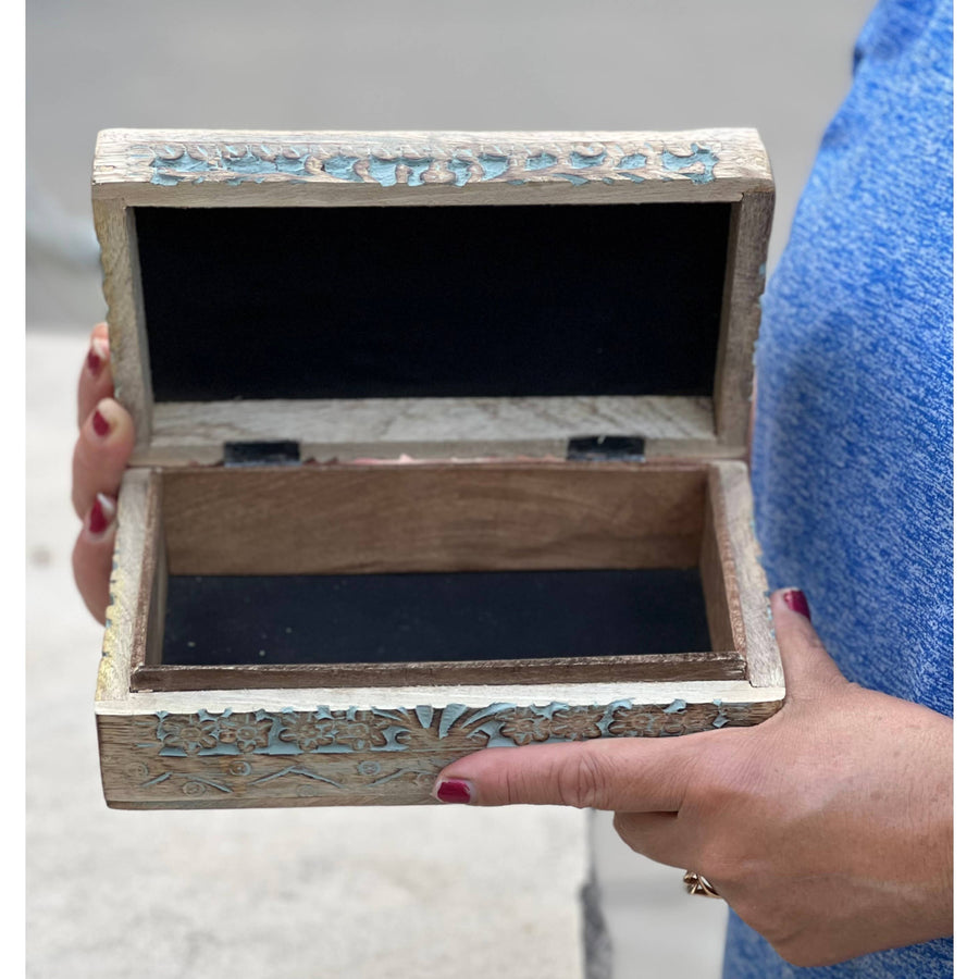 Open carved wooden lotus box used for stylish storage and decor purposes