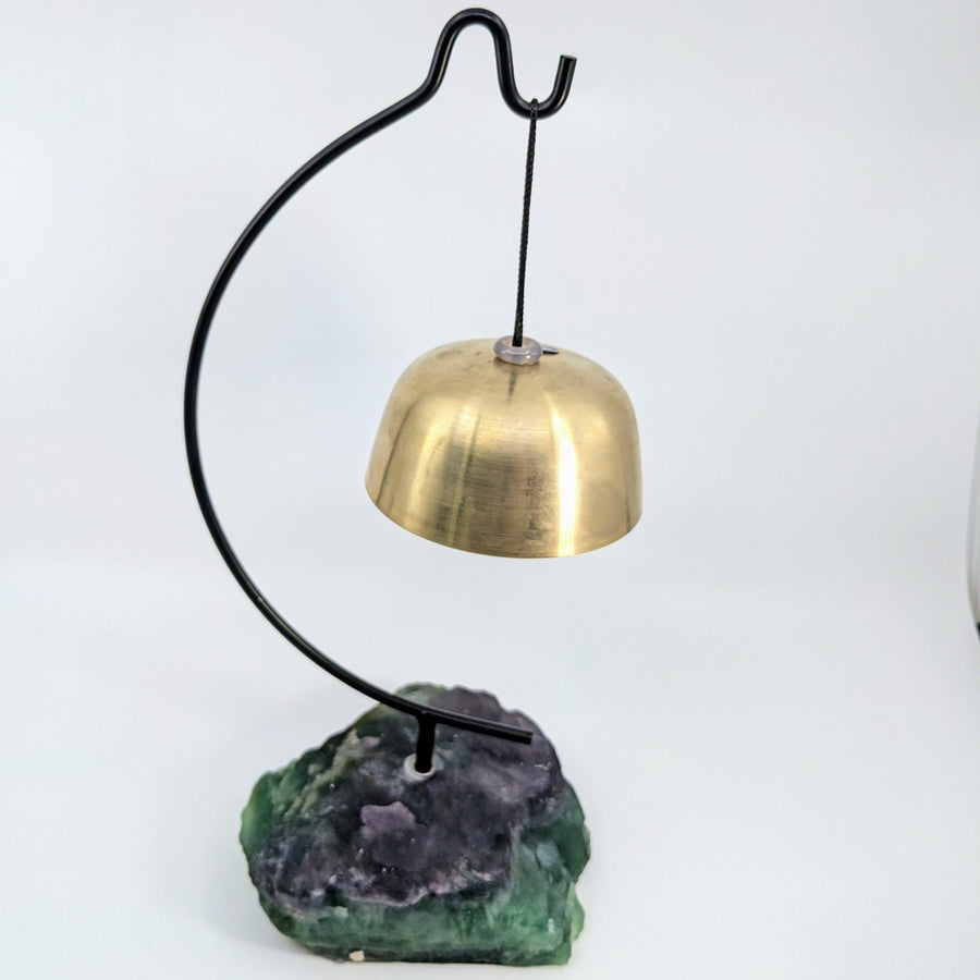 Brass bell resting on a vibrant fluorite base for the Hanging Singing Bowl 3.5 inch