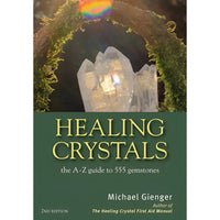 Healing crystals book by michael gienger featuring clear quartz gemstones on a mossy green archway with rainbow light