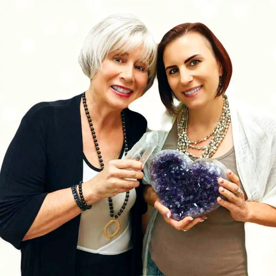 A heart-shaped amethyst crystal geode with deep purple coloring.