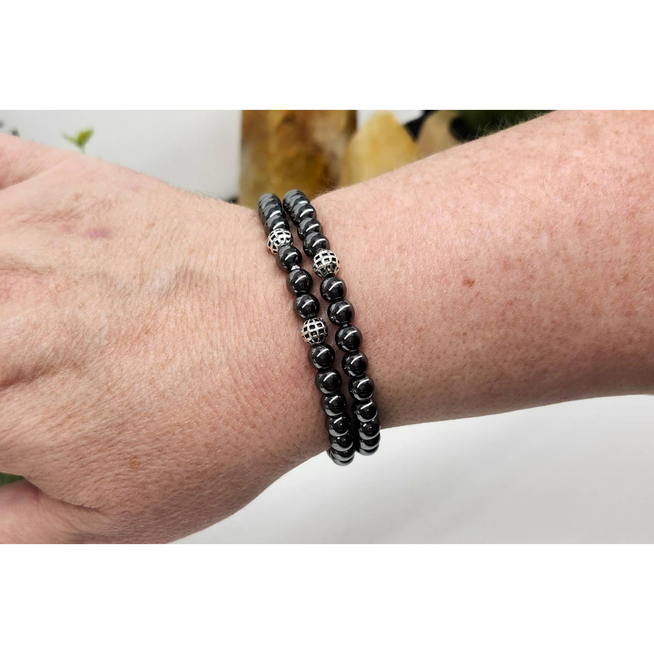 Black hematite double twist skull beaded bracelet with silver accents