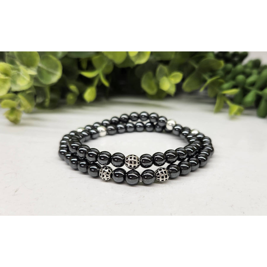 Black hematite double twist bracelet with silver accents and patterned beads