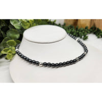 Elegant black pearl necklace with silver accents and hematite twist clasp