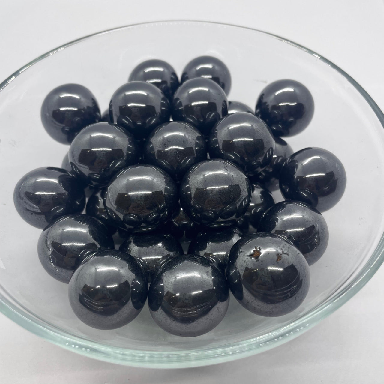 Black spherical Hematite beads clustered together for item tier benefits and style