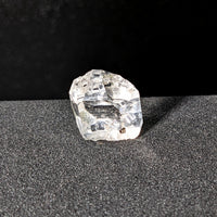 Thumbnail for Herkimer Diamond 1.7g Point #SK9462 sparkling on a sleek black surface