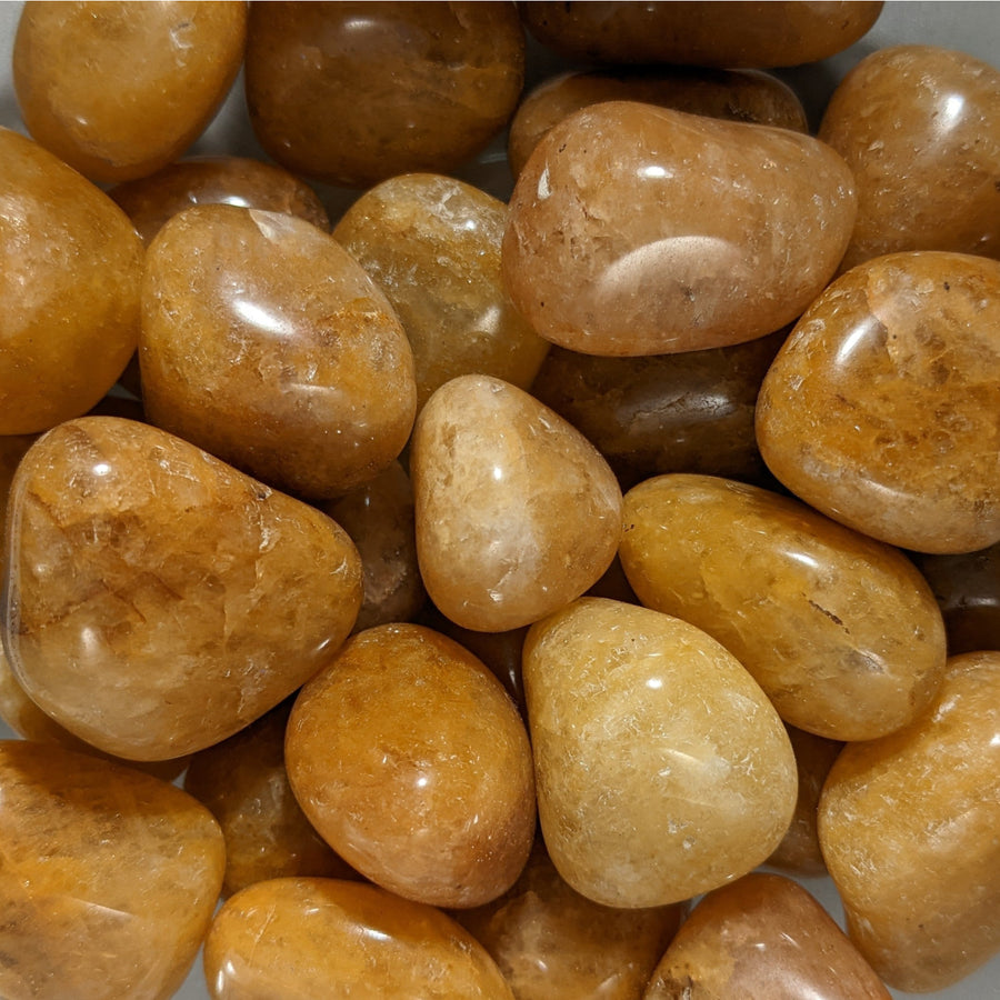Polished golden-yellow Himalayan Gold Quartz T270 tumbled stones